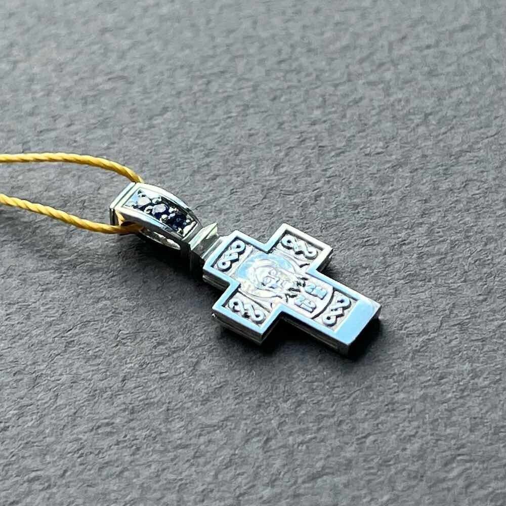 Купить Крест из белого золота "Спас Нерукотворный" с сапфирами (41049)