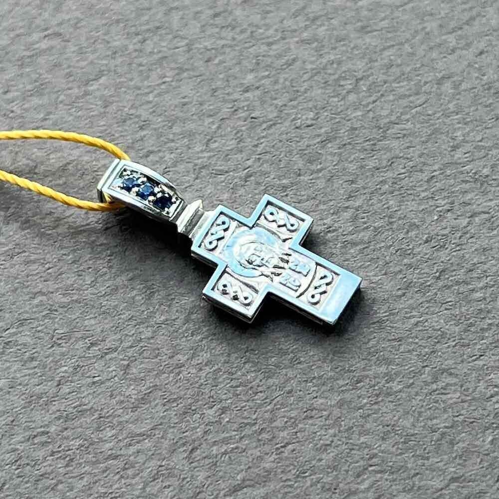 Купить Крест из белого золота "Спас Нерукотворный" с сапфирами (41049)